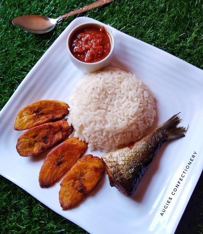 White Rice and stew, plantain, and Titus Fish 